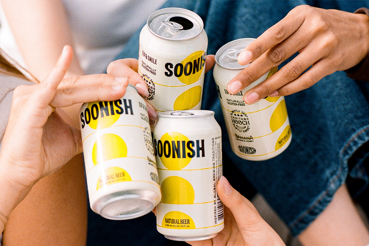 Soonish Cans in a portable cooler, filled with ice